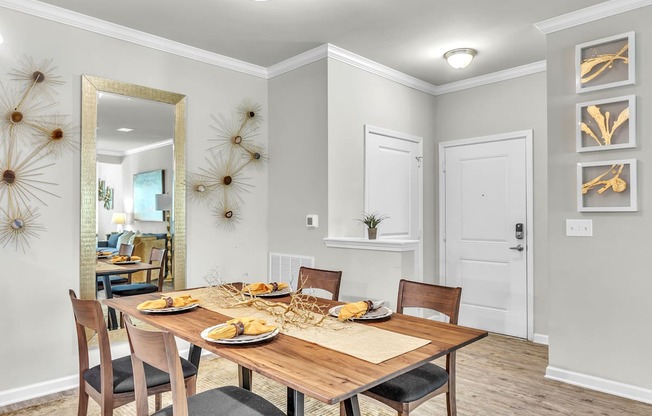 Dining room with a wooden table at Sterling Creek at Richmond Hill, Richmond Hill, GA, Georgia , 31324