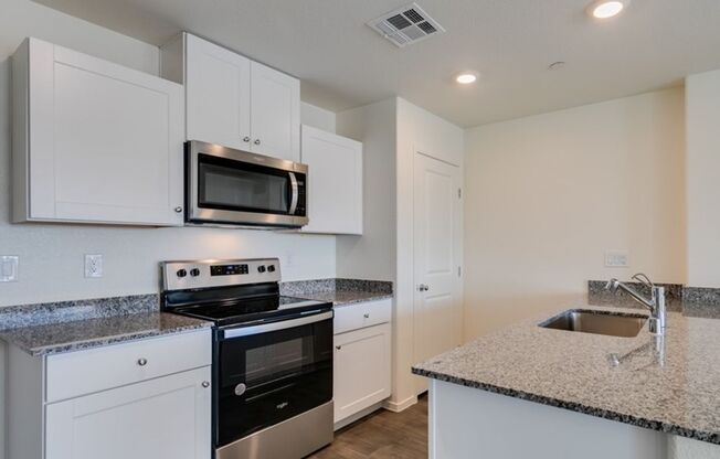 New townhome with attached 2 car garage.