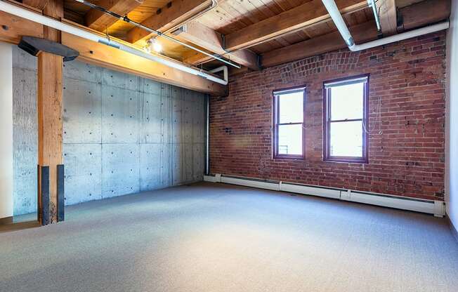 Living Area With Expansive Windows at Mercantile Housing, Denver