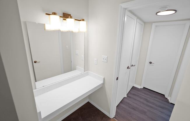 Vanity with mirror and lighting  at Huntington Apartments, Morrisville, NC, 27560