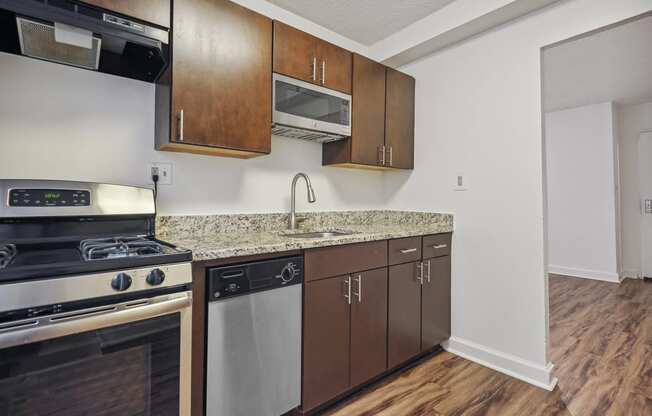 a kitchen with stainless steel appliances and a granite counter top