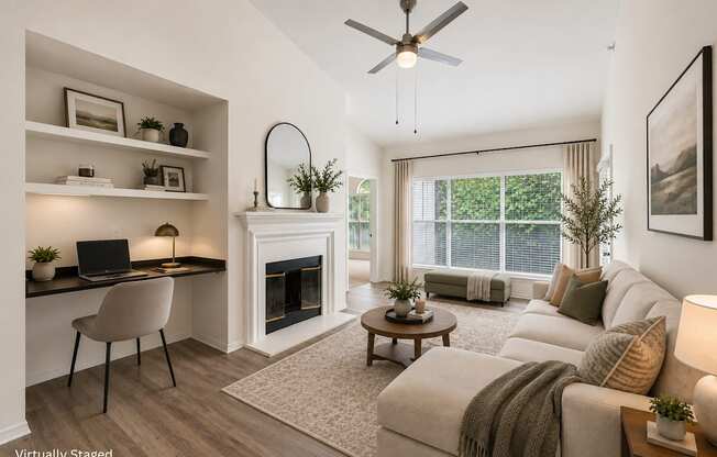 A living room with a fireplace, a couch, and a chair.