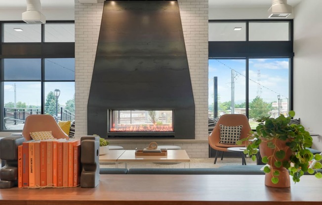 a living room with a fireplace and a large window