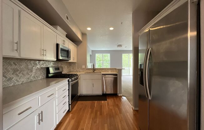 Spacious 3-Bedroom Forest Heights Townhome with Dual Primary Suites, Ground-Level Bedroom, Private Backyard & Wooded Views