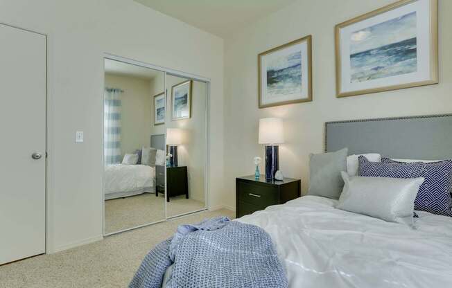 Model Bedroom with Carpet and Closet at Landings at Morrison Apartments located in Gresham, OR.