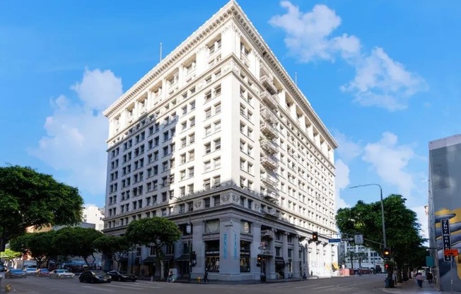 a large white building on the corner of a street