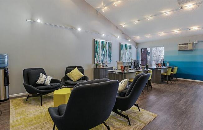 Clubhouse interior with white and blue wall colors and couch at Twelve 501 Apartment Homes, Burnsville, Minnesota