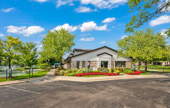 A building with a parking lot in front of it.