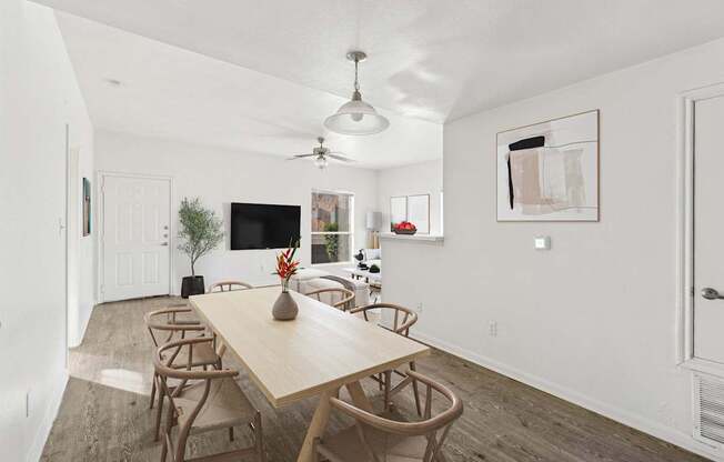 Affordable Apartments in Austin, TX for Rent- Huntington Meadows-  A dining room with a wooden table and chairs.