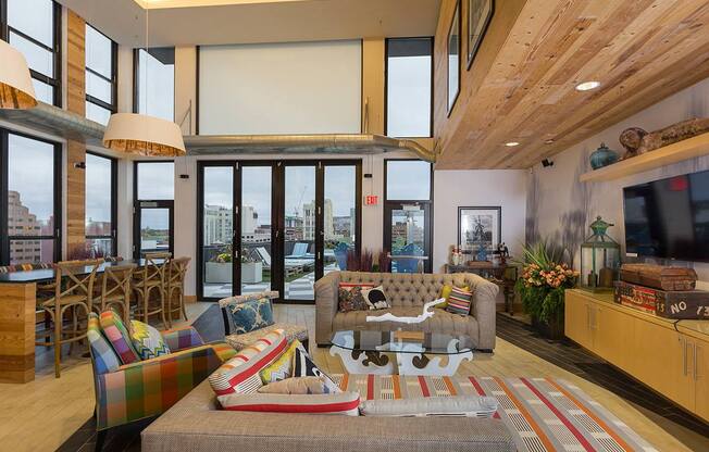 a living room with a couch and a table at Ann Arbor City Club, Michigan