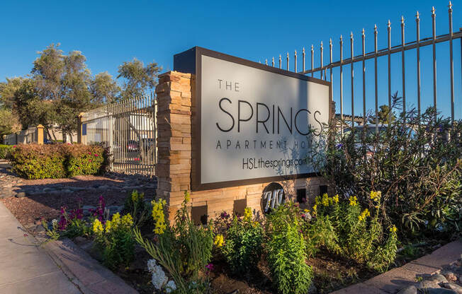 The Springs community sign with nice flowers planted all around