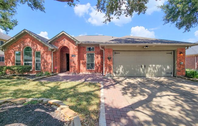 Custom glass and wrought iron front door welcomes you into this recently remodeled home. Italian tile throughout the home, custom fireplace, completely remodeled kitchen with granite countertops, and new appliances. The primary bath and closet have custo