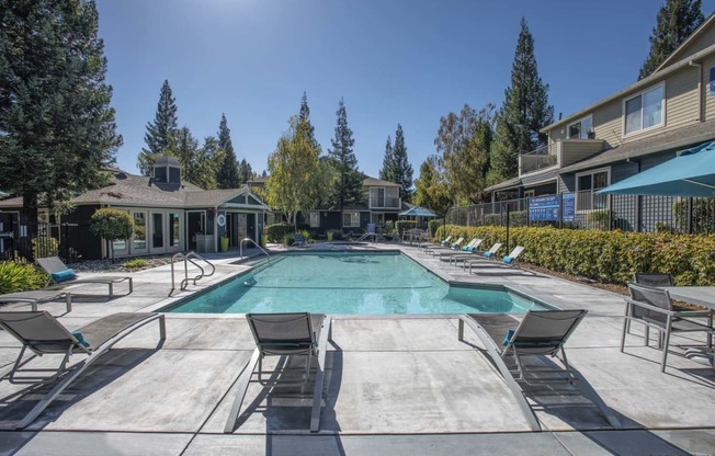 Swimming Pool With Lounge Chairs at Atwood Apartments, Citrus Heights, CA