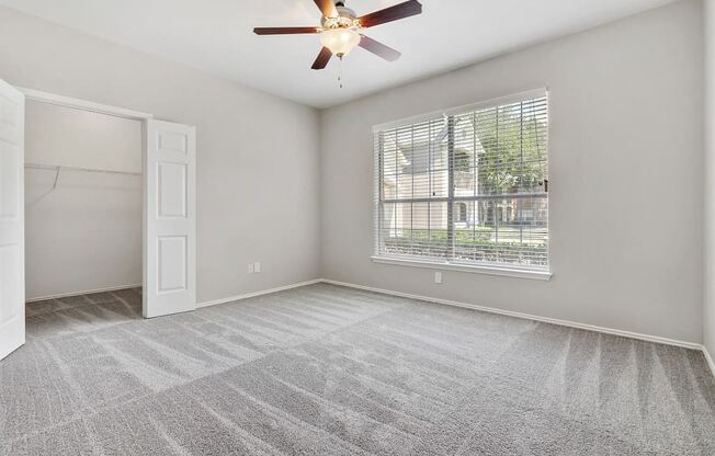 Carrington Park Apartments in Plano, TX with Wall to Wall Carpet, Walk-In Closet, Gray Walls, Large Window