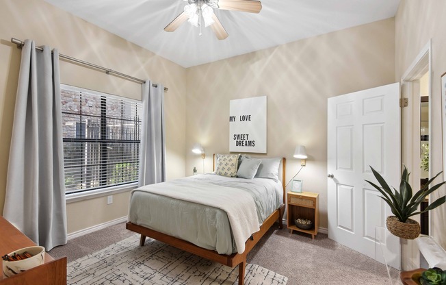 Bedrooms with 9-foot ceilings, oversized windows, and ceiling fans.