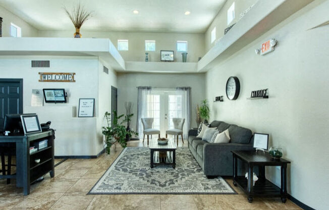 a living room with a couch and a table at Villas on Bell, Arizona, 85053