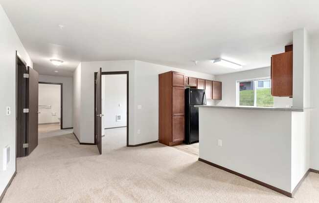 Pioneer Meadows Kitchen and View into Bedroom