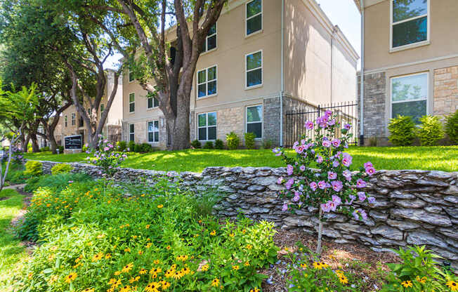 Building exteriors and landscaping at The Summit at Midtown Apartments in Midtown, Dallas, TX.