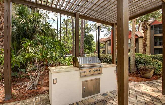 a covered patio with a gas grill at Timberwalk at Mandarin Apartment Homes, Florida, 32257