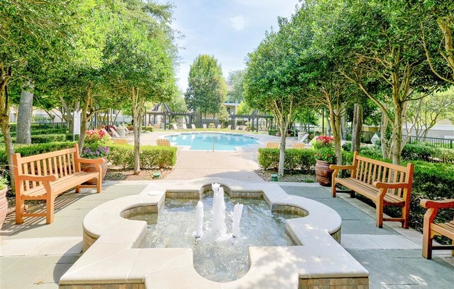 Fountain and resort pool at Saxony at Chase Oaks in North Plano, TX, For Rent. Now leasing 1, 2 and 3 bedroom apartments.