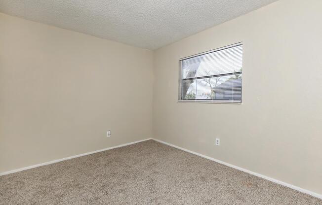 a bedroom with a large mirror