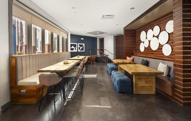 a dining room with wooden tables and chairs and benches