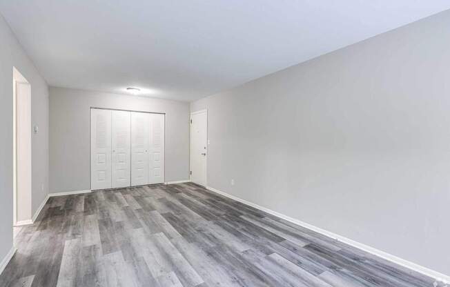 A room with a grey floor and white walls.