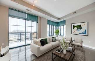 living room with floor to ceiling windows