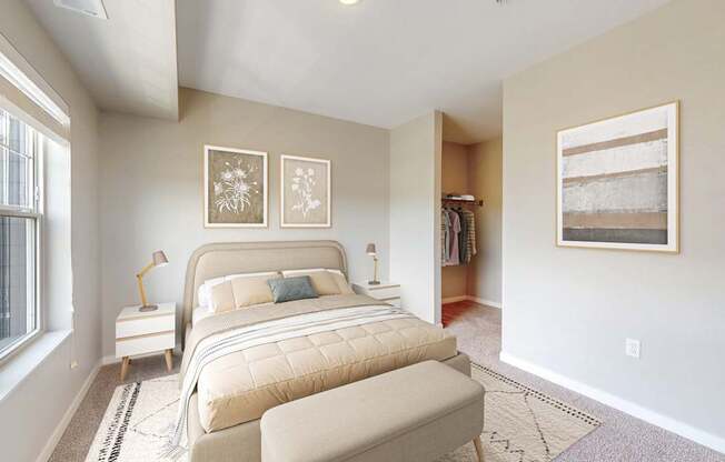 A bedroom with a large bed and a window.