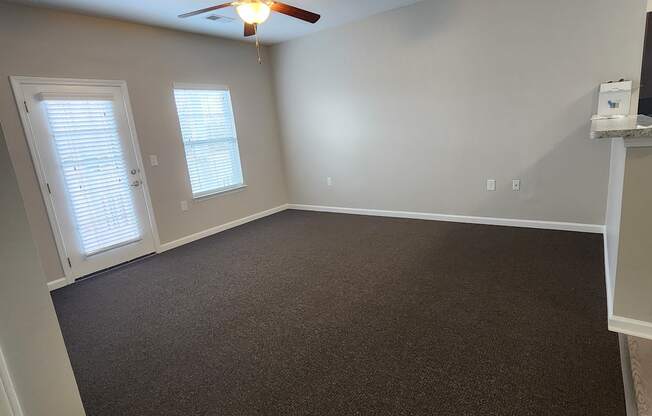 Spacious Living Room with Ceiling Fan at The Assembly Apartments, Greenville