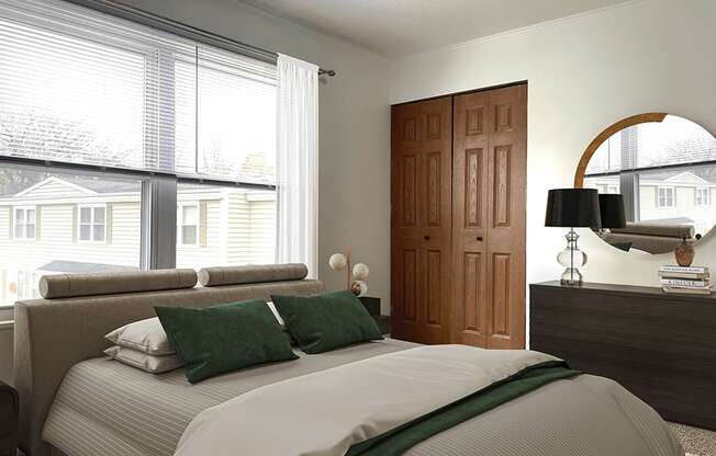 A bedroom with a large bed and a wooden door.