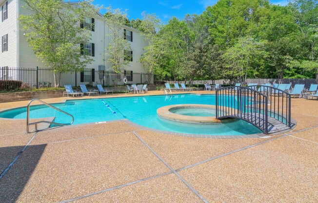 our apartments have a resort style pool with a fence around it at Reserve of Jackson Apartment Homes, Mississippi, 39211