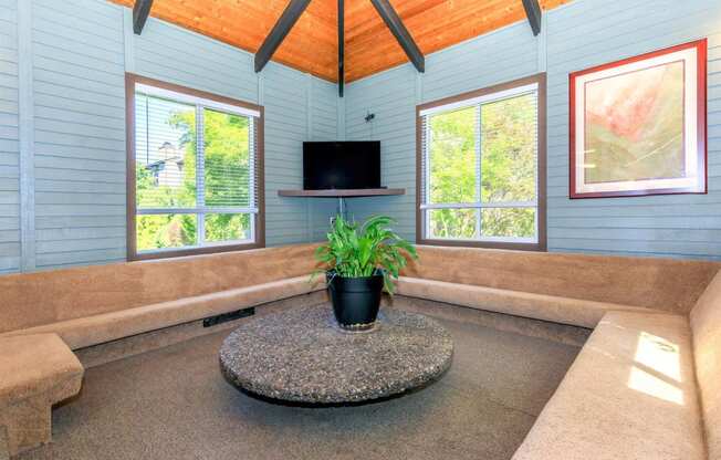 a living room with a couch and a tv at Lincoln Village Apartments, Spokane, 99208
