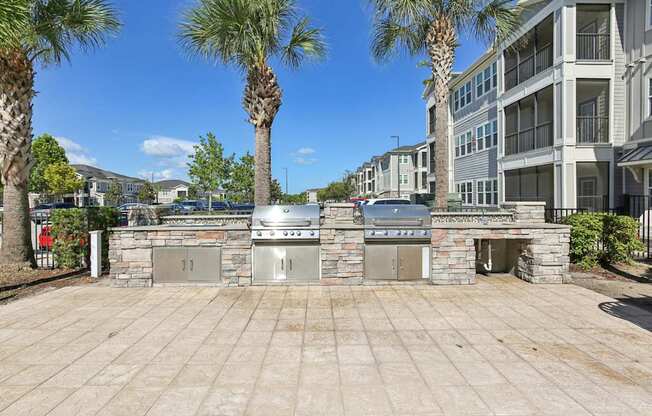 Outdoor grill area with seating at Lotus at Starkey Ranch in Odessa, Florida.
