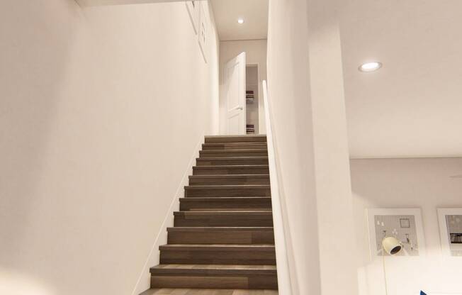 a view from the bottom of the stairs looking up at Brownstones at Palisade Park Townhomes, Broomfield Colorado
