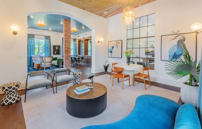 A living room with a blue couch and a coffee table.