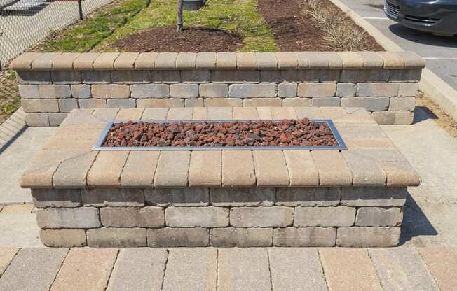 a retaining wall with a flower bed in the middle of it