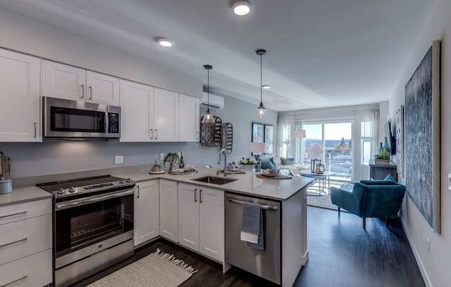 All Lux kitchen and living room spaces include stainless steel appliances, including dishwasher and overhead microwave/exhaust as well as built-in air conditioning