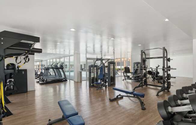 high-impact fitness center with free weights at One Santa Fe apartments