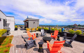 Apartments Seattle WA - Metroline Flats - Rooftop Deck with Lounge Chairs, Fire Pit, Tables, and Grill