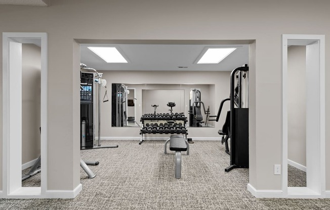 the gym at the enclave at woodbridge apartments in sugar land, tx at Millcreek Woods Apartments, Olathe