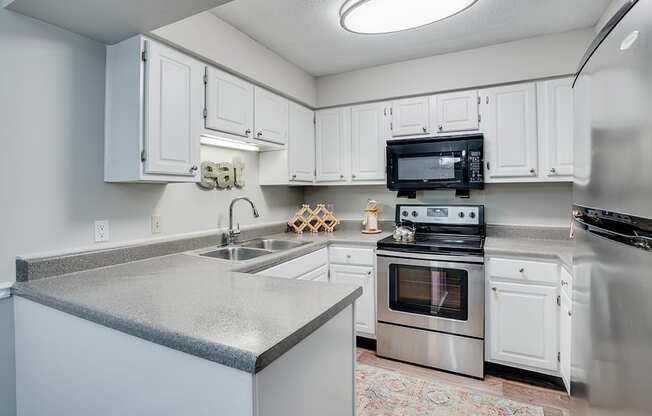 Kitchen with Stainless Steel Appliances and White Cabinetry