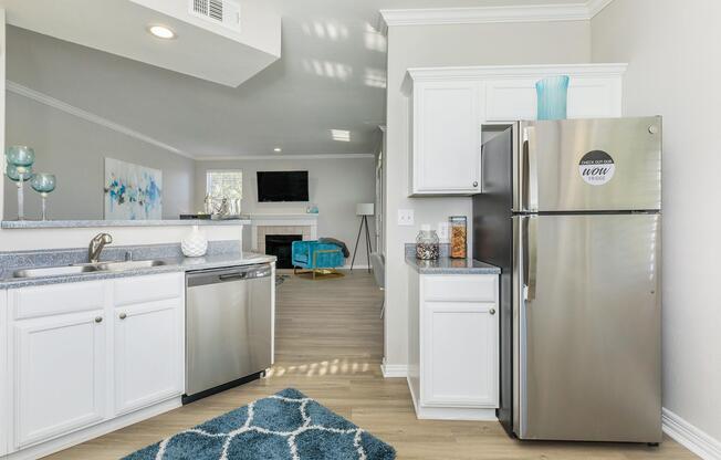 a kitchen with a sink and a refrigerator