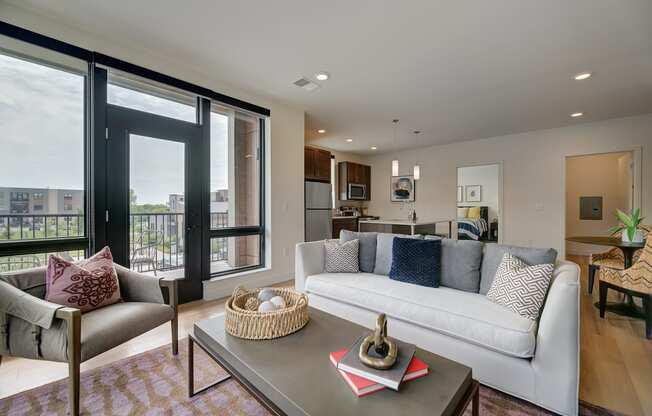 a living room with a couch and chairs and a table at Statesman Apartments, Franklin, WI 53132