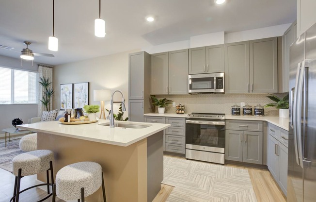 South Scottsdale Apartments - Lucent Scottsdale - Luxury Kitchen with Quartz countertops with undermount sinks and ceramic tile backsplash.