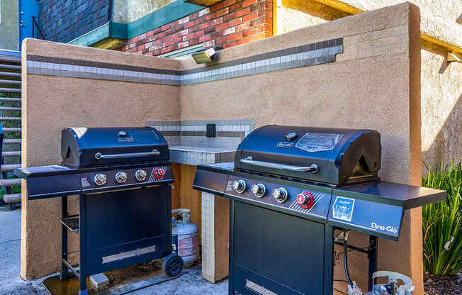 Community barbecue area with two barbeques.