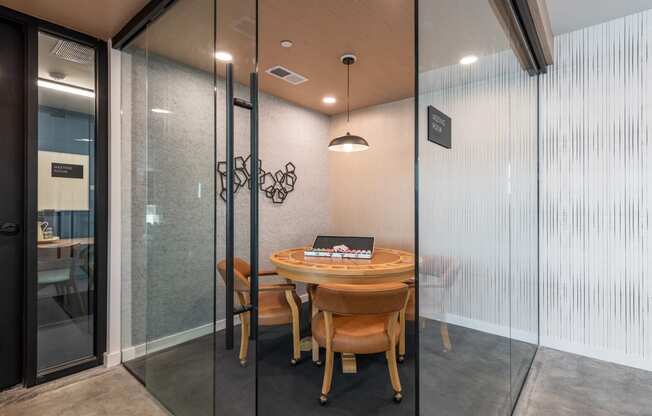 a table and chairs in a room with glass doors