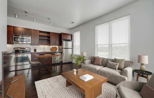 A modern kitchen with a breakfast table and a couch.