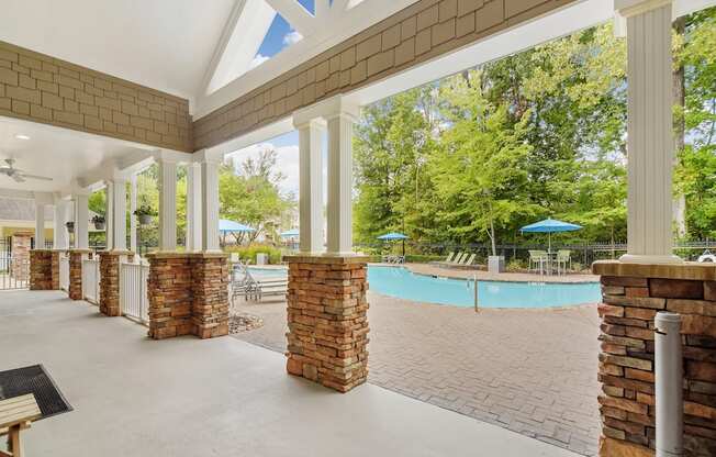 Covered lounge at the community pool at Highlands Apartments in Bartlett, TN