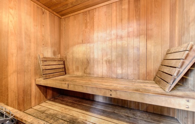 Community sauna with wood paneling through out 